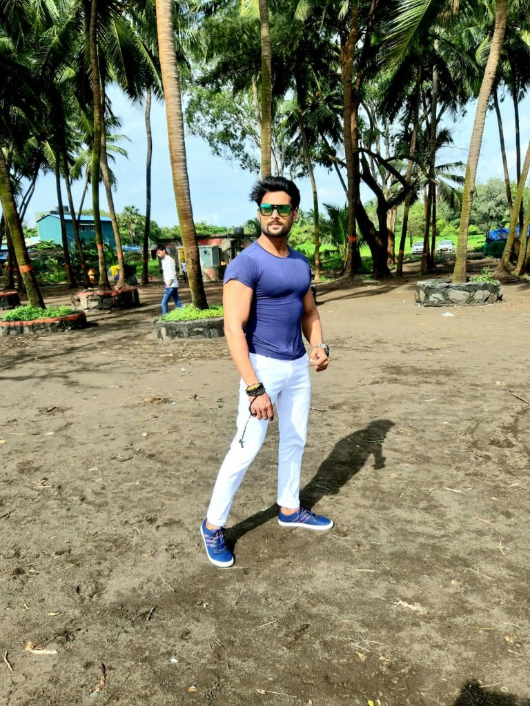 Manav Pardeshi outdoor portrait among palms